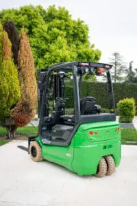 Green CESAB B3 electric forklift outside on a terrace, left side view. - Prince Maasdijk
