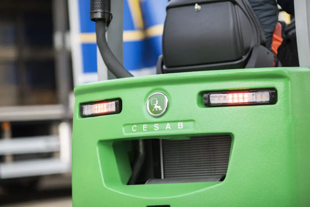 Close-up of the rear of a green CESAB forklift with logo and LED taillights. - Prince Maasdijk