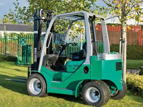 Green Prince Tiger XL forklift outside on a lawn, right-front view. - Prince Maasdijk